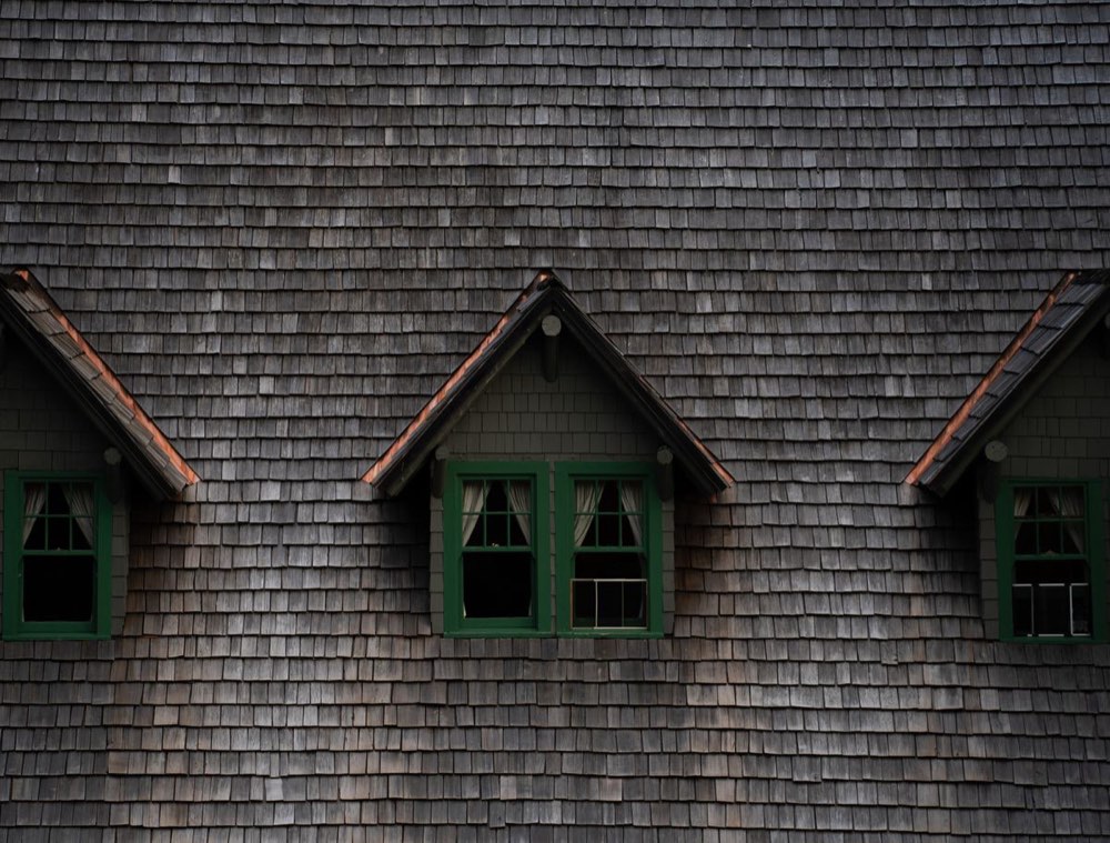 Weathered cedar shingle roof with dormers
